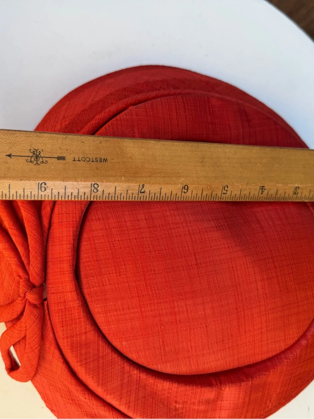 Vintage 1960s saucer style hat rusty orange fabric bow size OS no label.